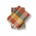 Folded Pestemal Turkish towel with traditional striped pattern in earthy tones
